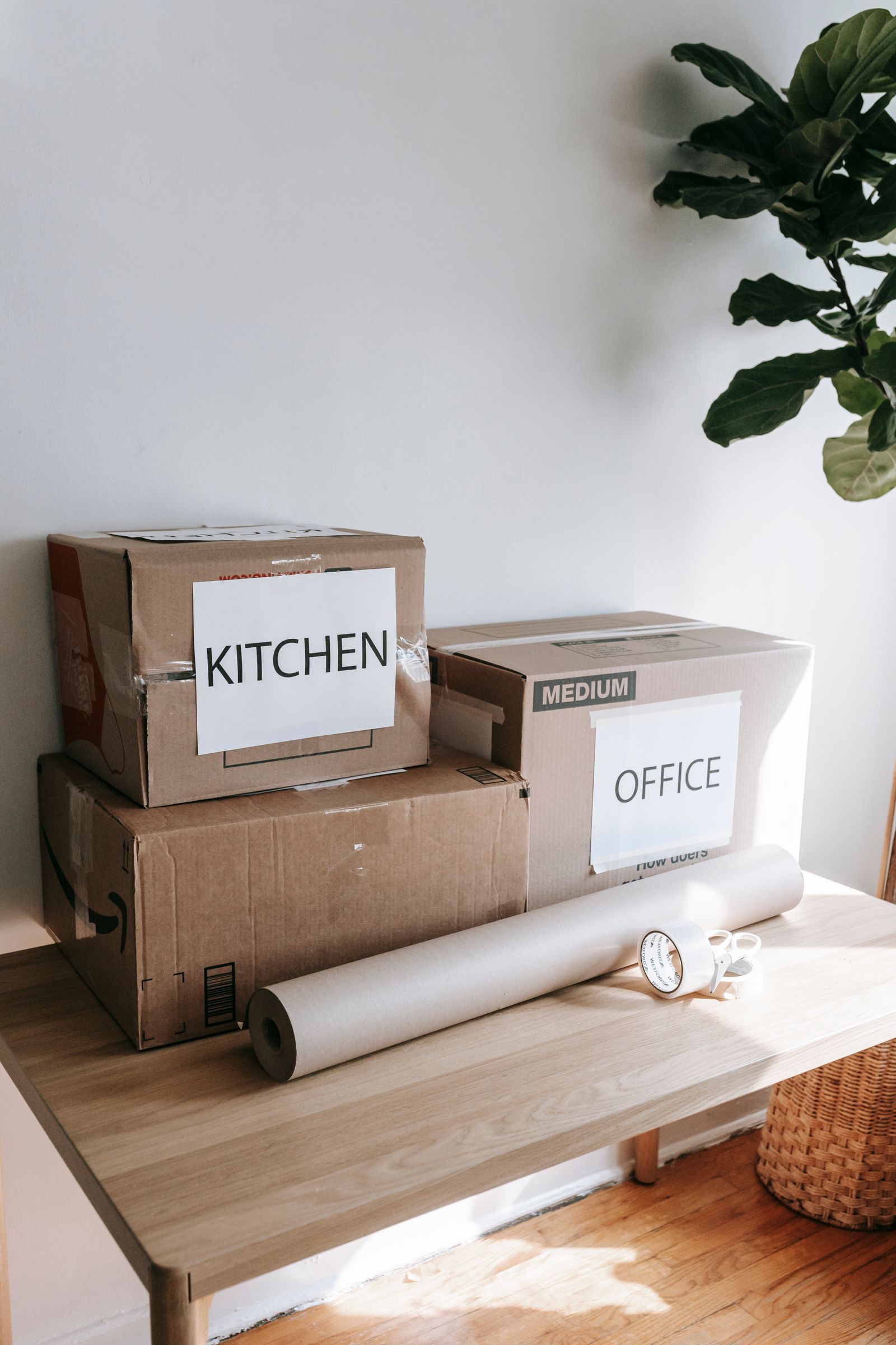 Packing supplies ready for a move, including cardboard boxes and padding materials